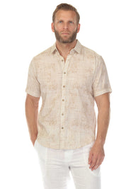 Front view of a man wearing a beige Men’s Cross Hatch Short Sleeve Button Down Resort Shirt.