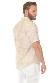 Side view of a man wearing a tan cross hatch Men’s Resort Shirt with short sleeves and a button down collar.