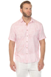 Front view of a man wearing a pink Men’s Cross Hatch Short Sleeve Button Down Resort Shirt.