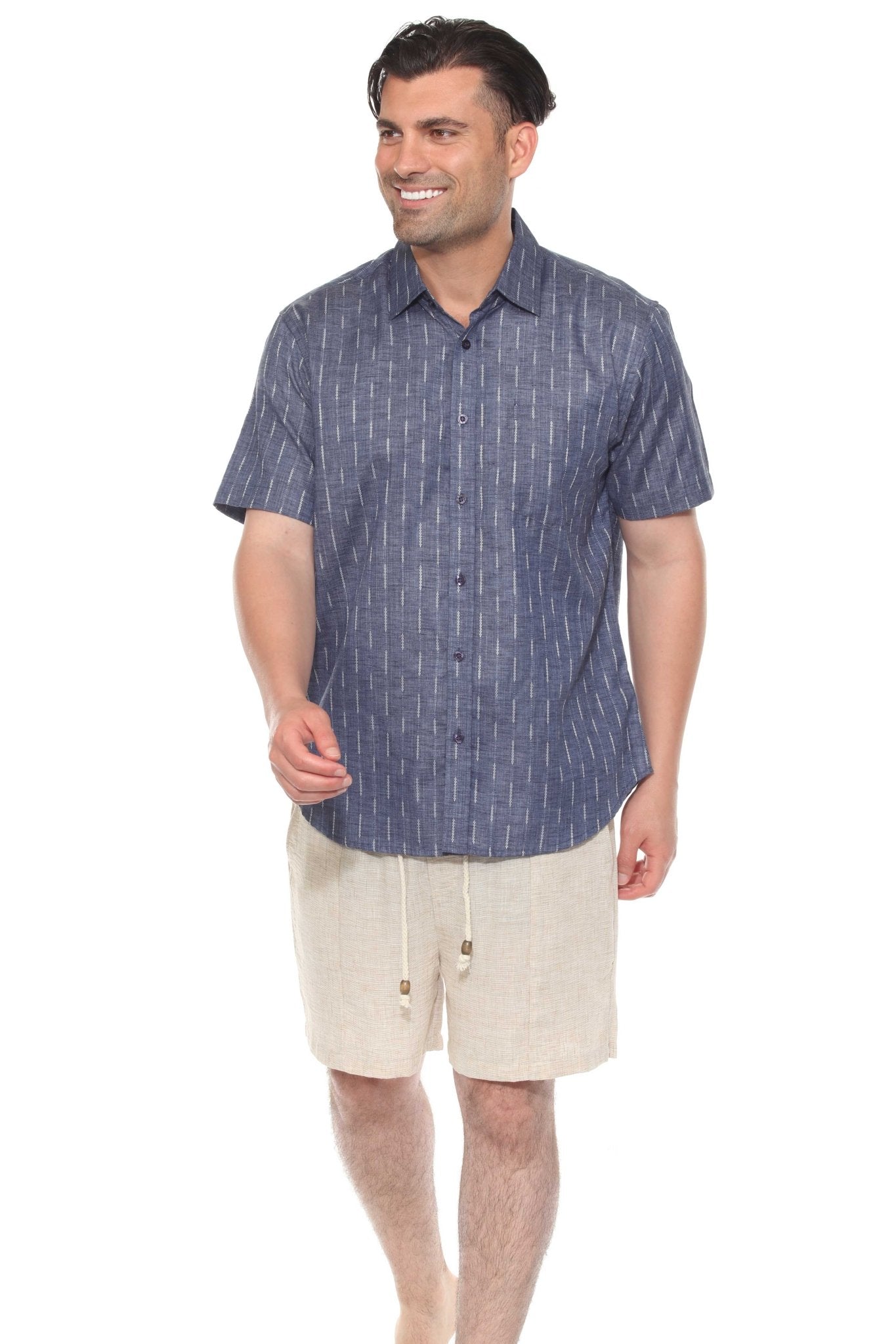 A man smiles wearing the blue cotton blend, short-sleeve, button-up Menâ€™s Pinstripe Resort Shirt.