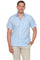 A man wears a light blue Menâ€™s Pinstripe Resort Shirt, a short sleeve button-up, with white pinstripes.
