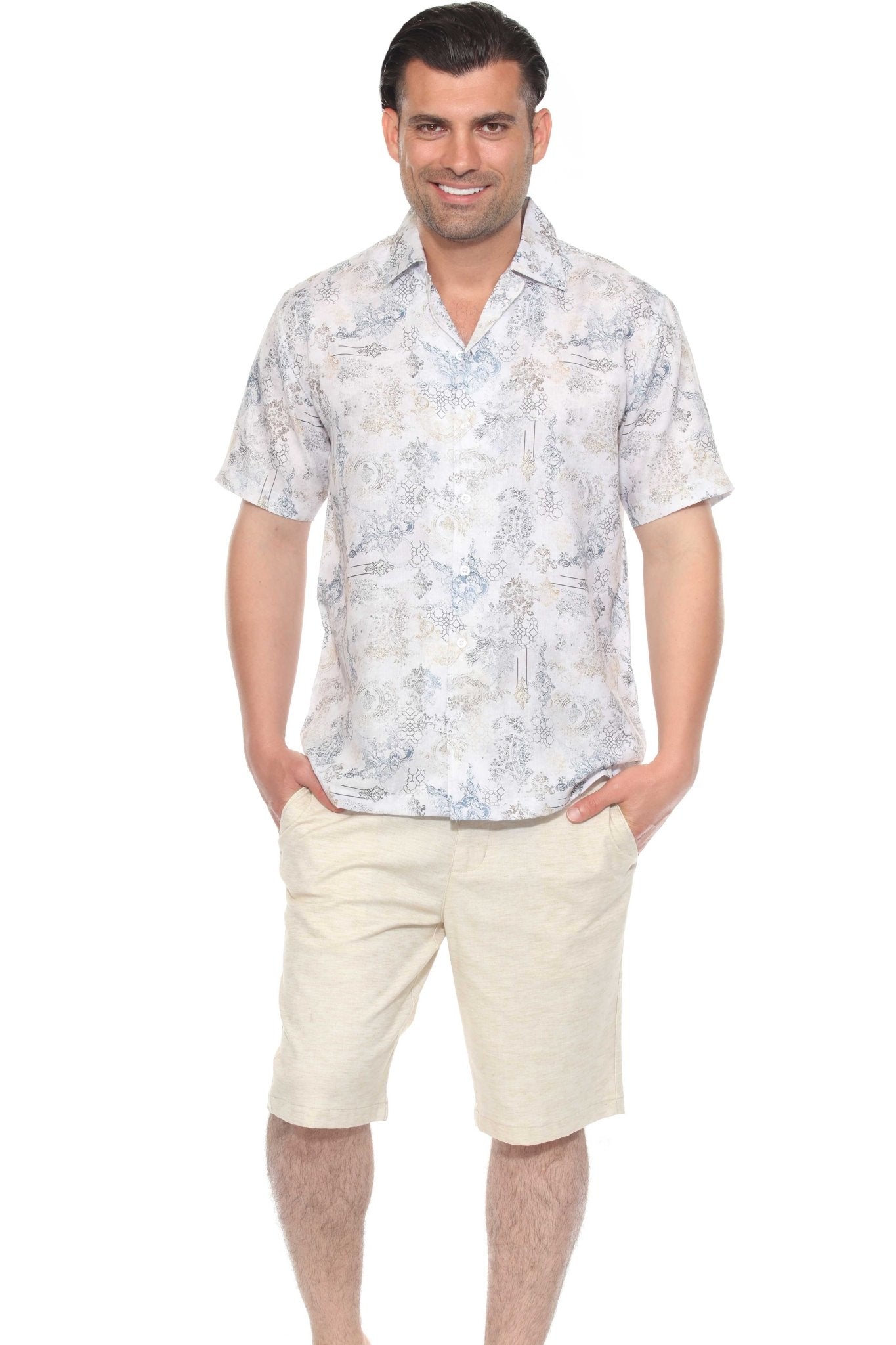 Full view: A man smiles, wearing the white, patterned Men's Tropical Print Resort Shirt button-up.