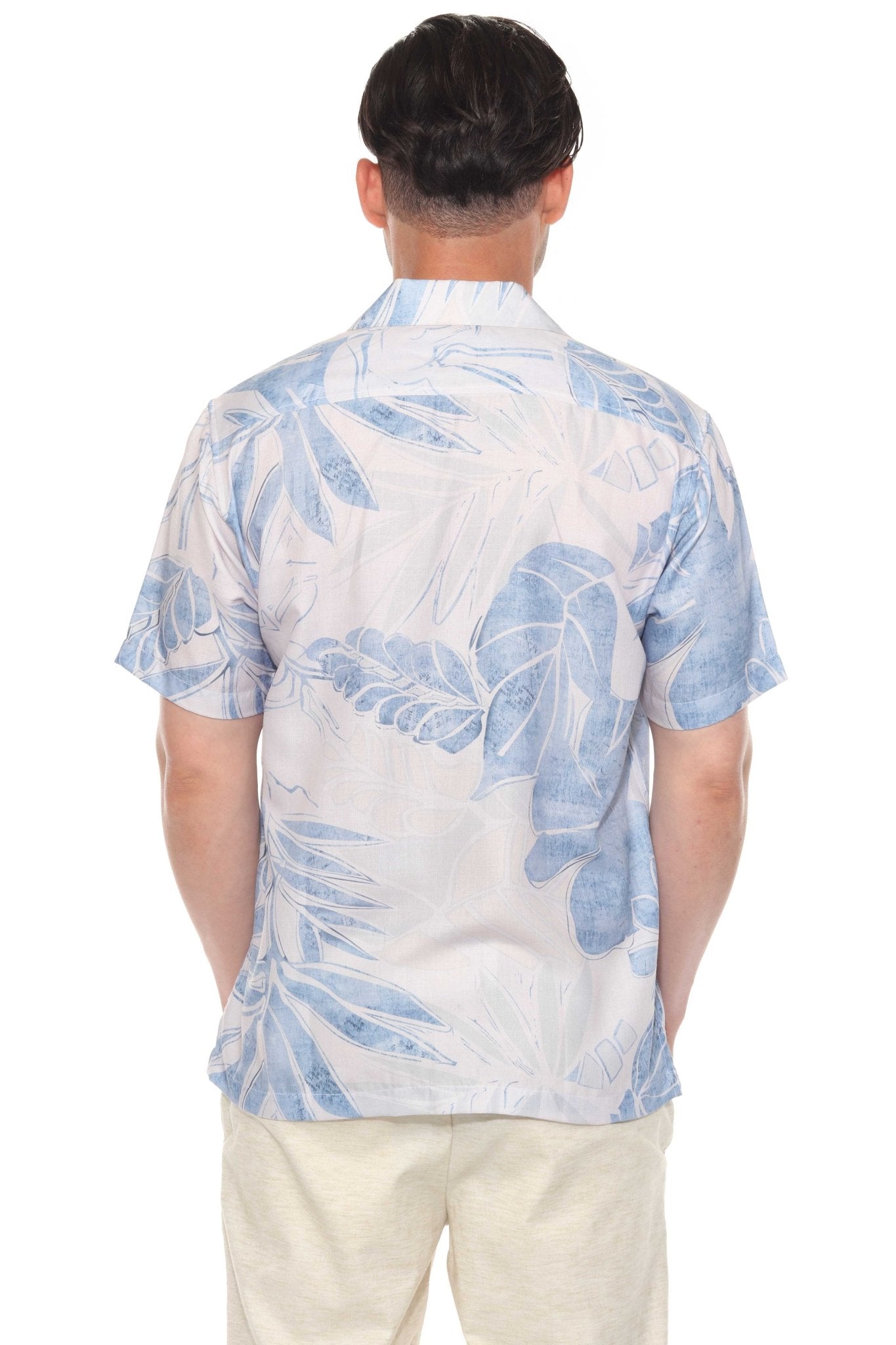 Back view of a man wearing a Men’s Tropical Print Resort Shirt with a white and blue leaf pattern.