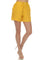 Front view of Women's Casual Beach Wear Short with Drawstring Waist in golden-yellow, worn with light-tan high heels.