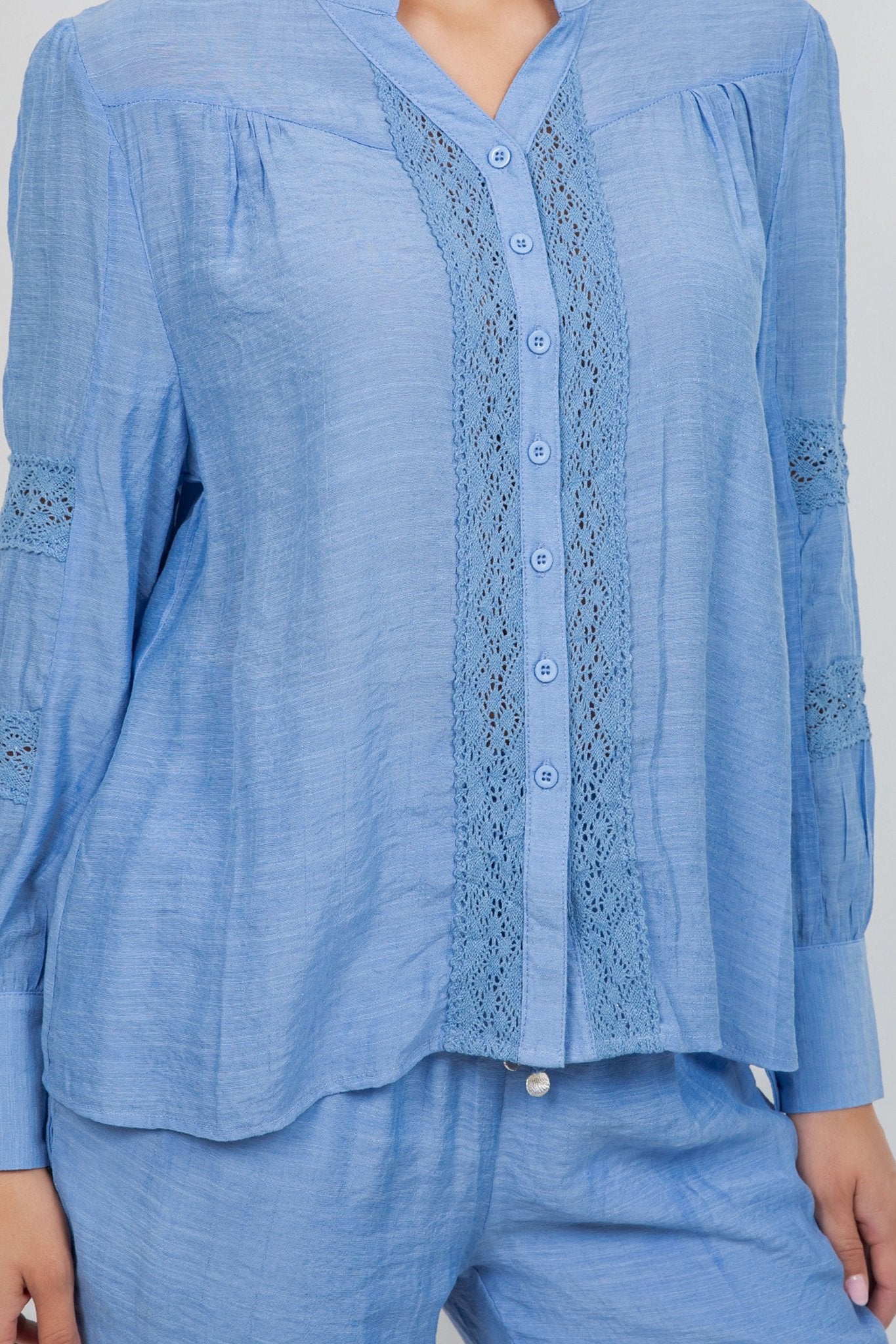 Blue Ladies Boho Lace Panel Pleated Long Sleeve Blouse, front view showing the center lace panel and buttons.