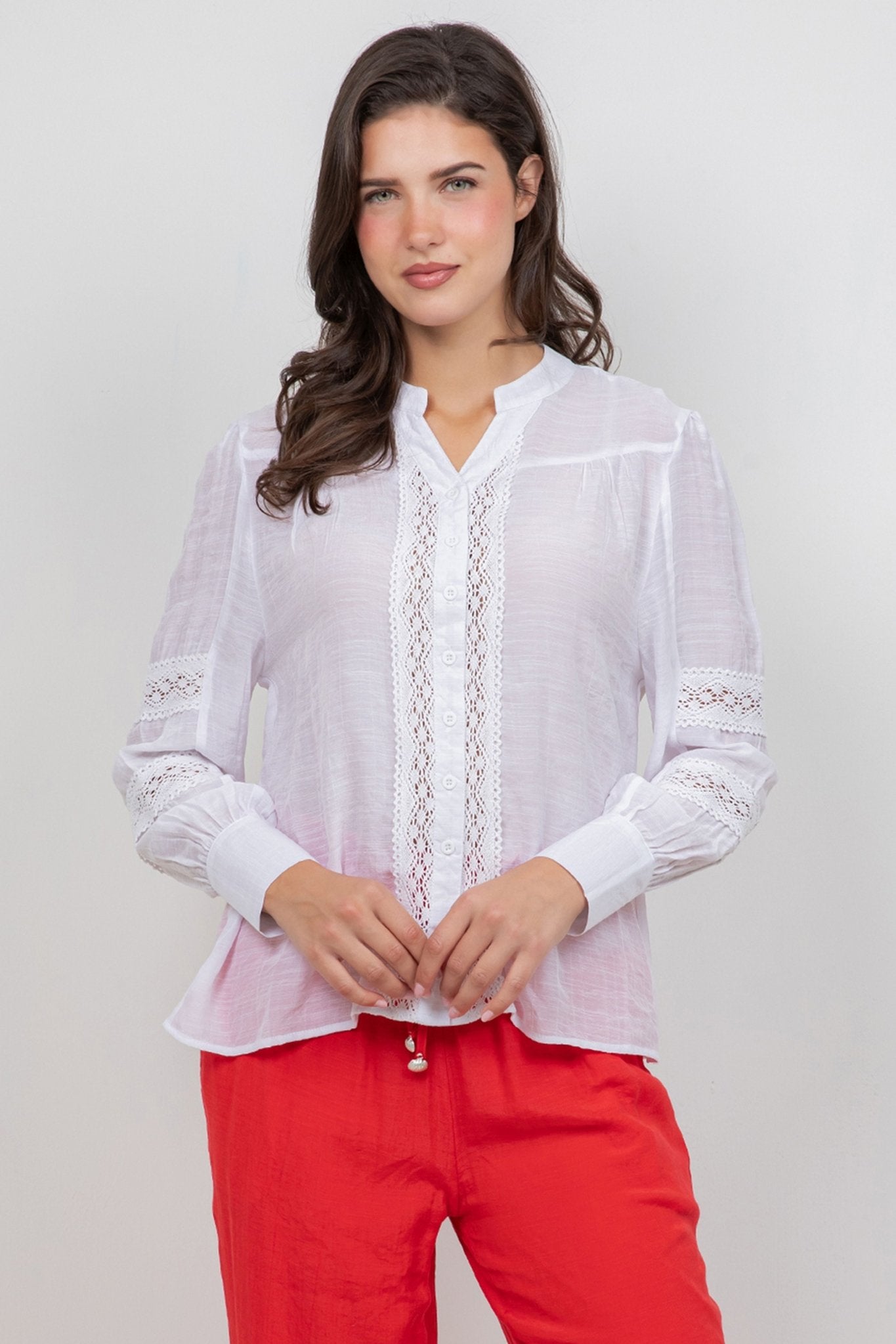 A woman models the Ladies Boho Lace Panel Pleated Long Sleeve Blouse, showing the lace detail and mandarin collar.