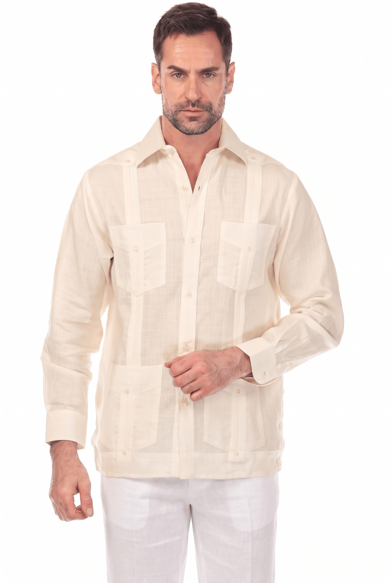 Front view of a man modeling a natural beige, long-sleeve Irish Linen Four Pocket Guayabera Shirt with white linen pants.