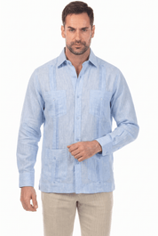 Front view of a man modeling a light blue, long-sleeve Irish Linen Four Pocket Guayabera Shirt.