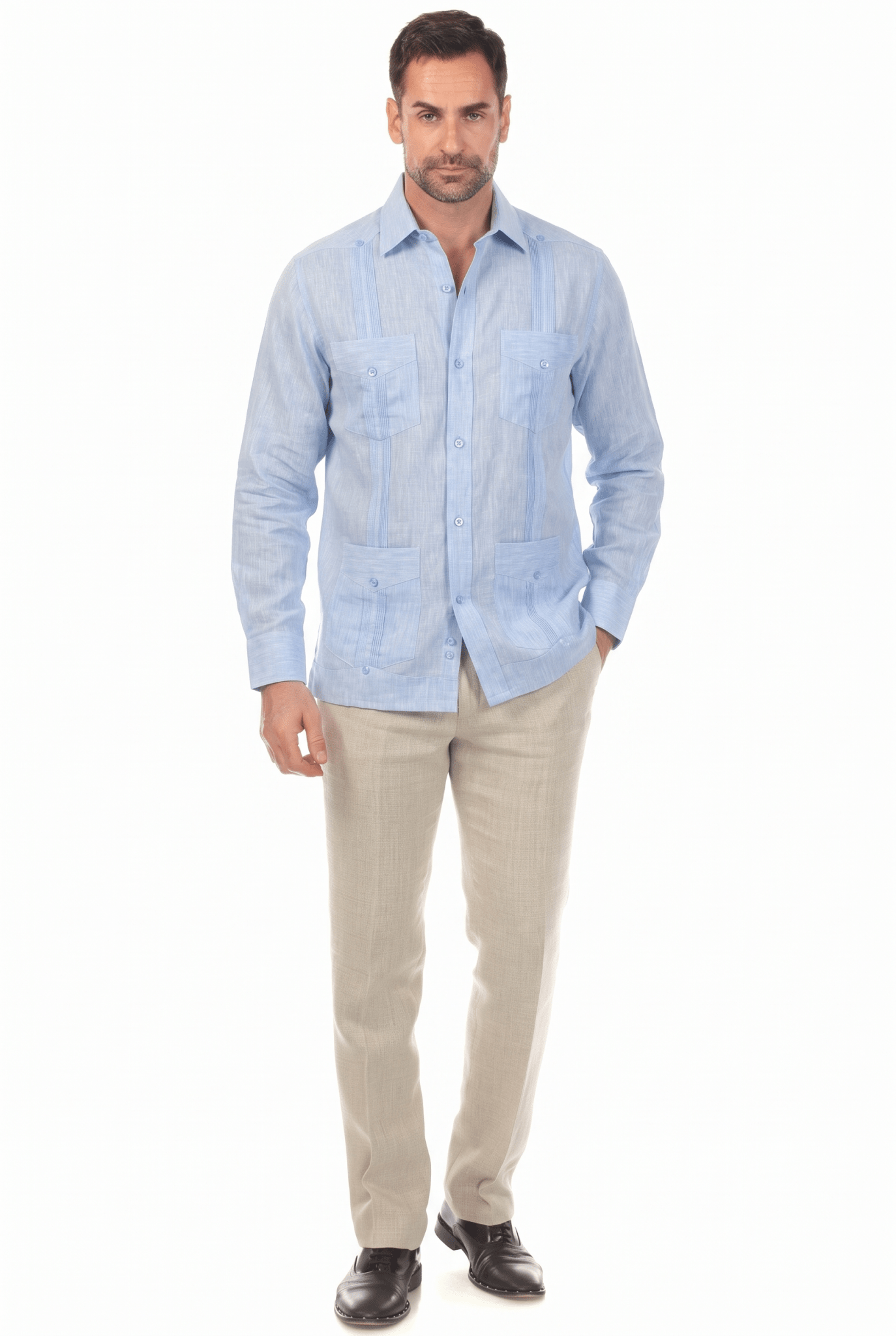 Man wearing a light blue, long-sleeve Irish Linen Four Pocket Guayabera Shirt, full-length front view.