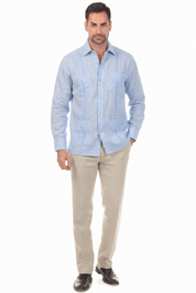 Man wearing a light blue, long-sleeve Irish Linen Four Pocket Guayabera Shirt, full-length front view.