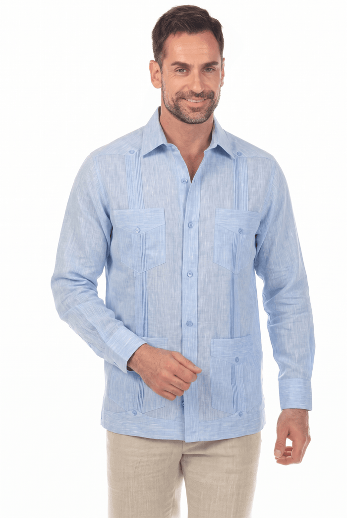 Front view of a man modeling a white, long-sleeve Irish Linen Four Pocket Guayabera Shirt.