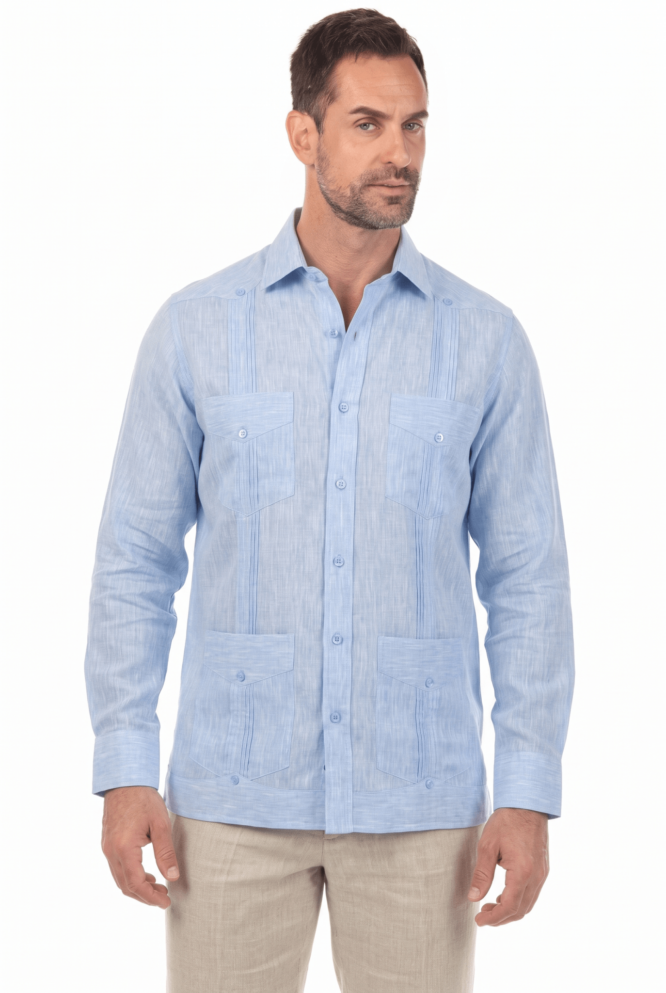 A man models a light blue, long-sleeve Irish Linen Four Pocket Guayabera Shirt, shown at a slight angle.