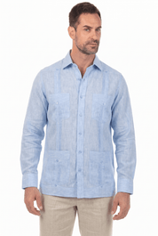 A man models a light blue, long-sleeve Irish Linen Four Pocket Guayabera Shirt, shown at a slight angle.
