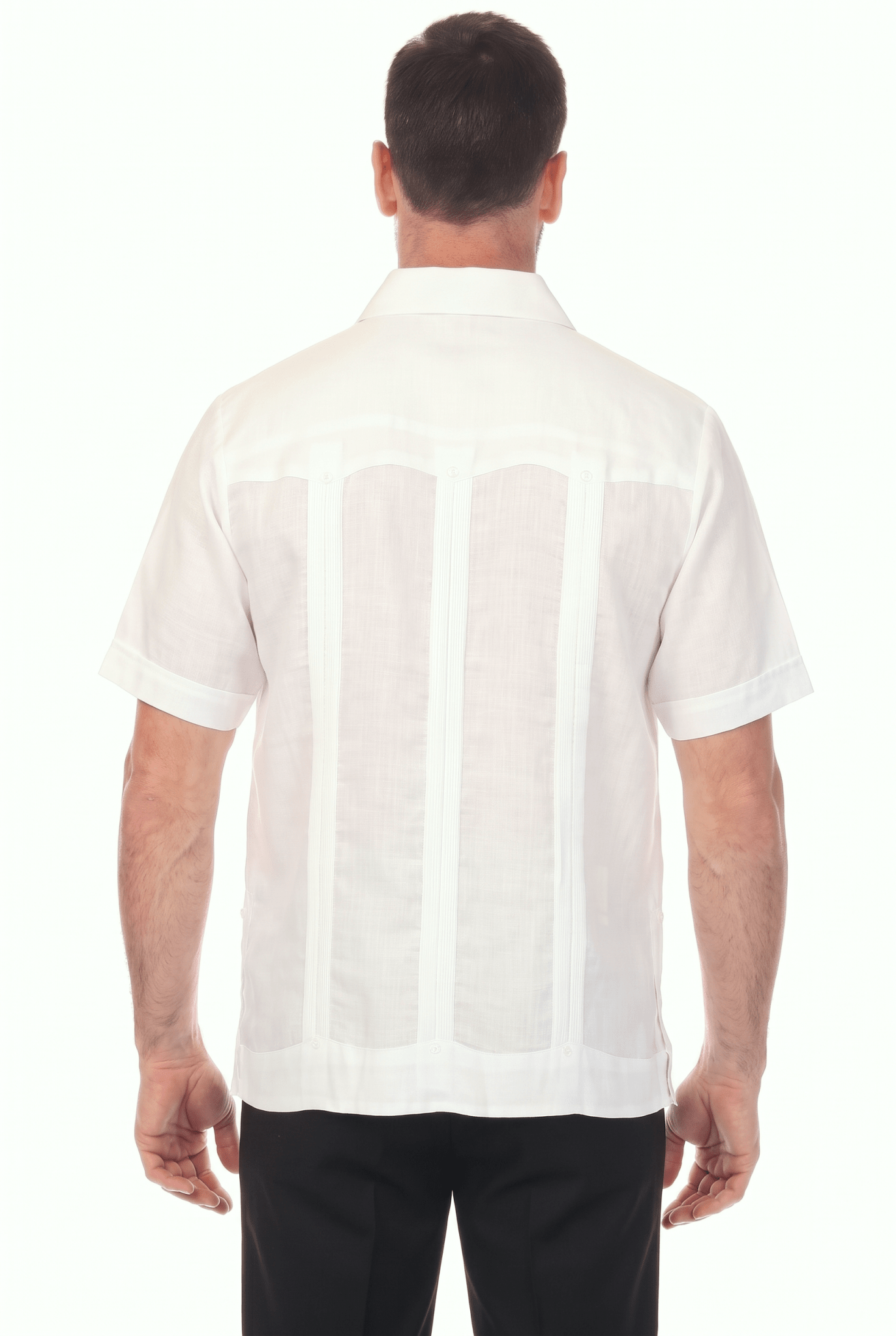 Back view of a man wearing a white, short-sleeve Irish Linen Four Pocket Guayabera Shirt.