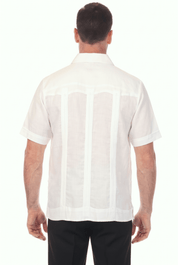 Back view of a man wearing a white, short-sleeve Irish Linen Four Pocket Guayabera Shirt.