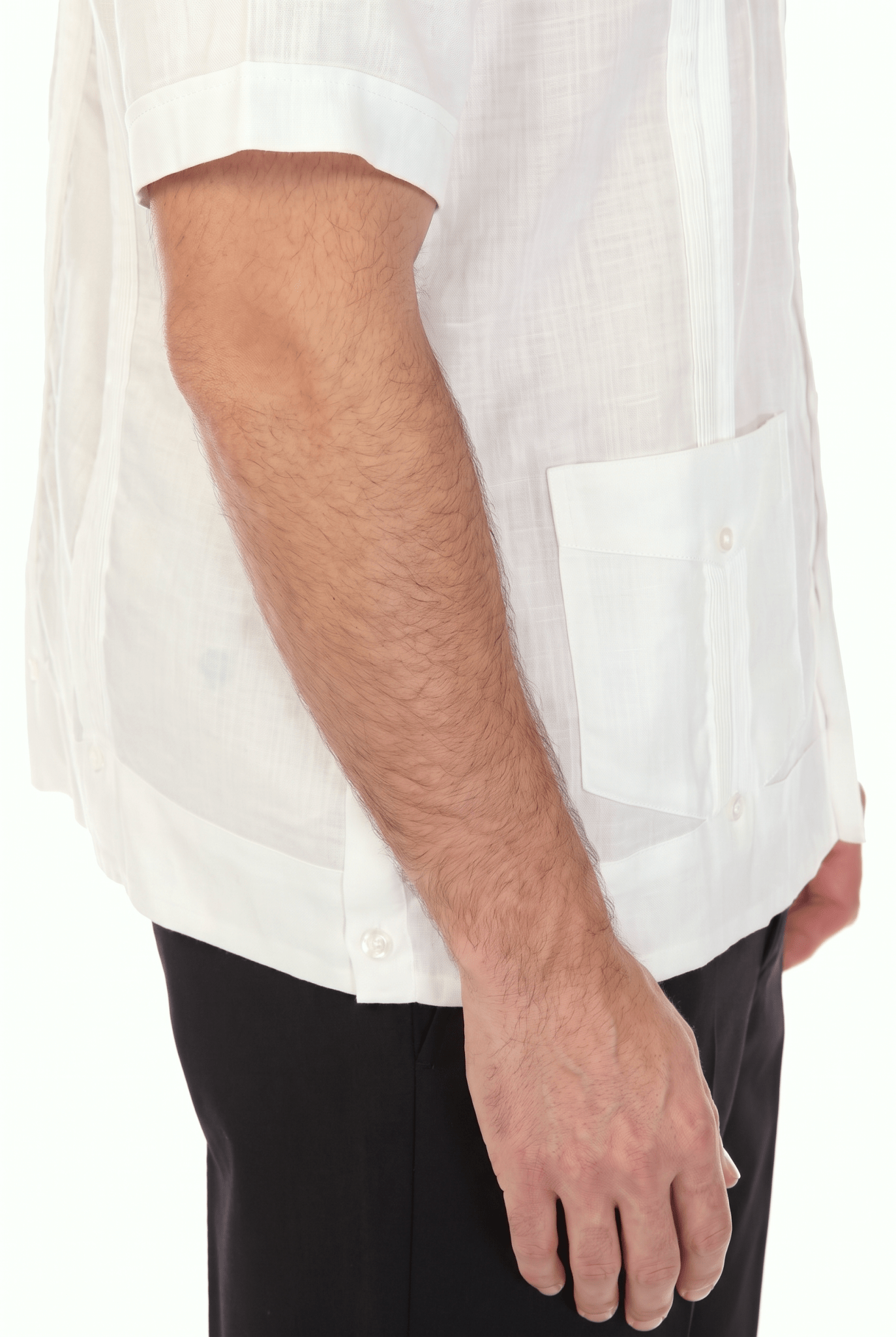 Close-up of a white short-sleeve Irish Linen Four Pocket Guayabera Shirt, showing the lower pocket and sleeve hem.