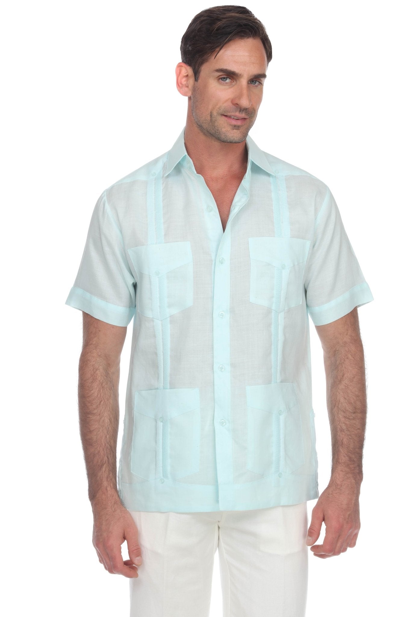 Front view of a man wearing a light blue, short sleeve Men’s Big & Tall 100% Linen Classic Guayabera Shirt with four flap pockets.