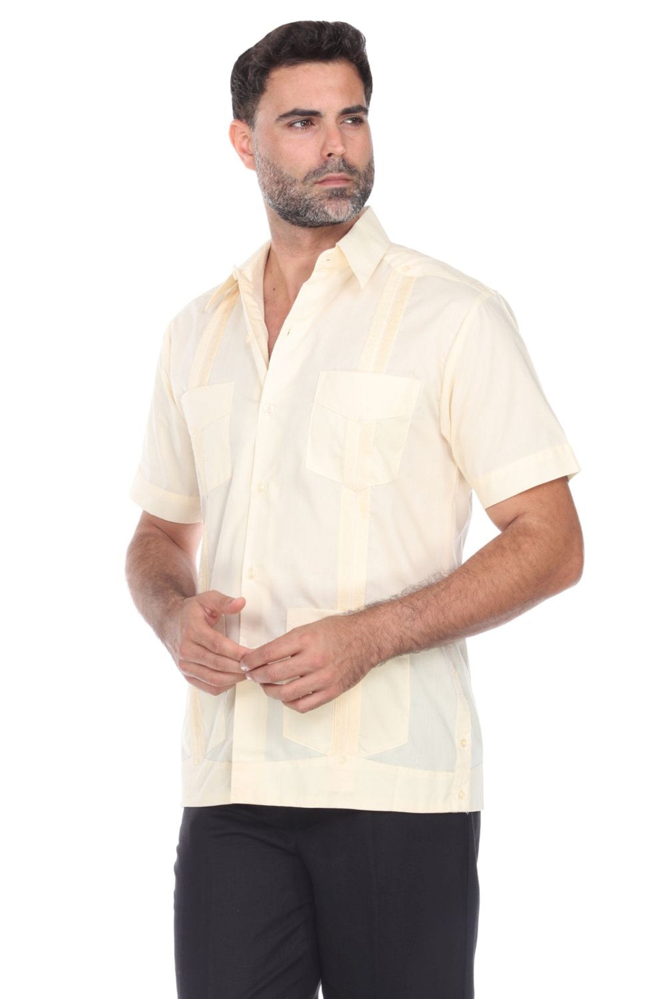 Side angle of a short sleeve linen guayabera shirt in cream, ideal for summer weddings and resort wear.