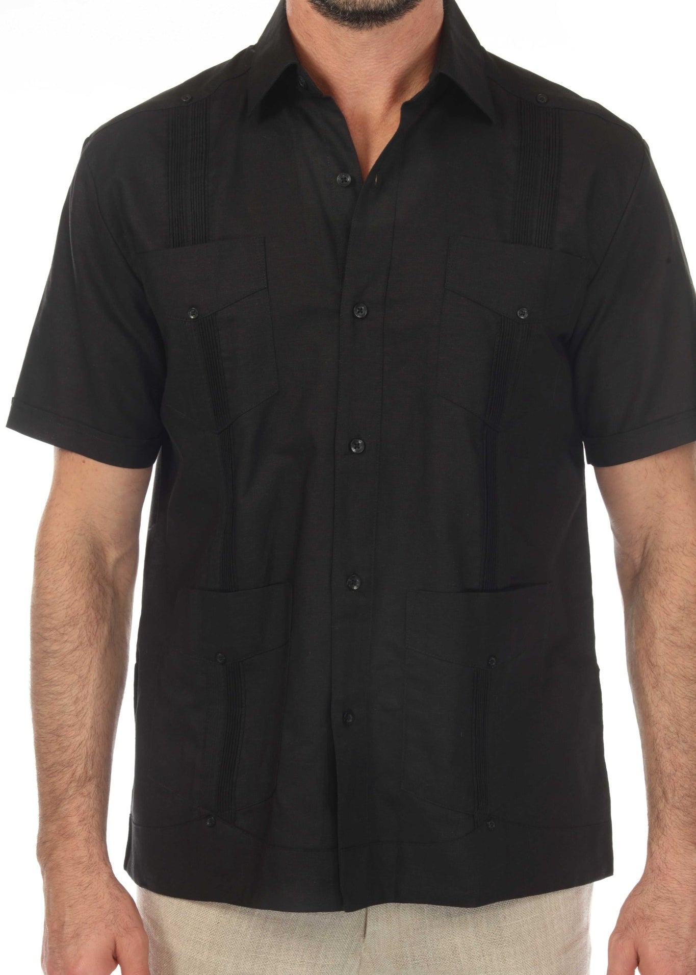 The back of a black short sleeve linen guayabera shirt with traditional vertical pleats and breathable fabric.