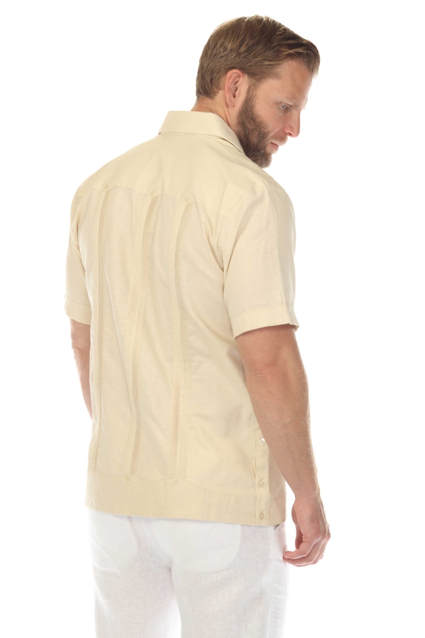Rear side view of the cream guayabera shirt, emphasizing the breathable linen texture and classic vertical alforza pleats.