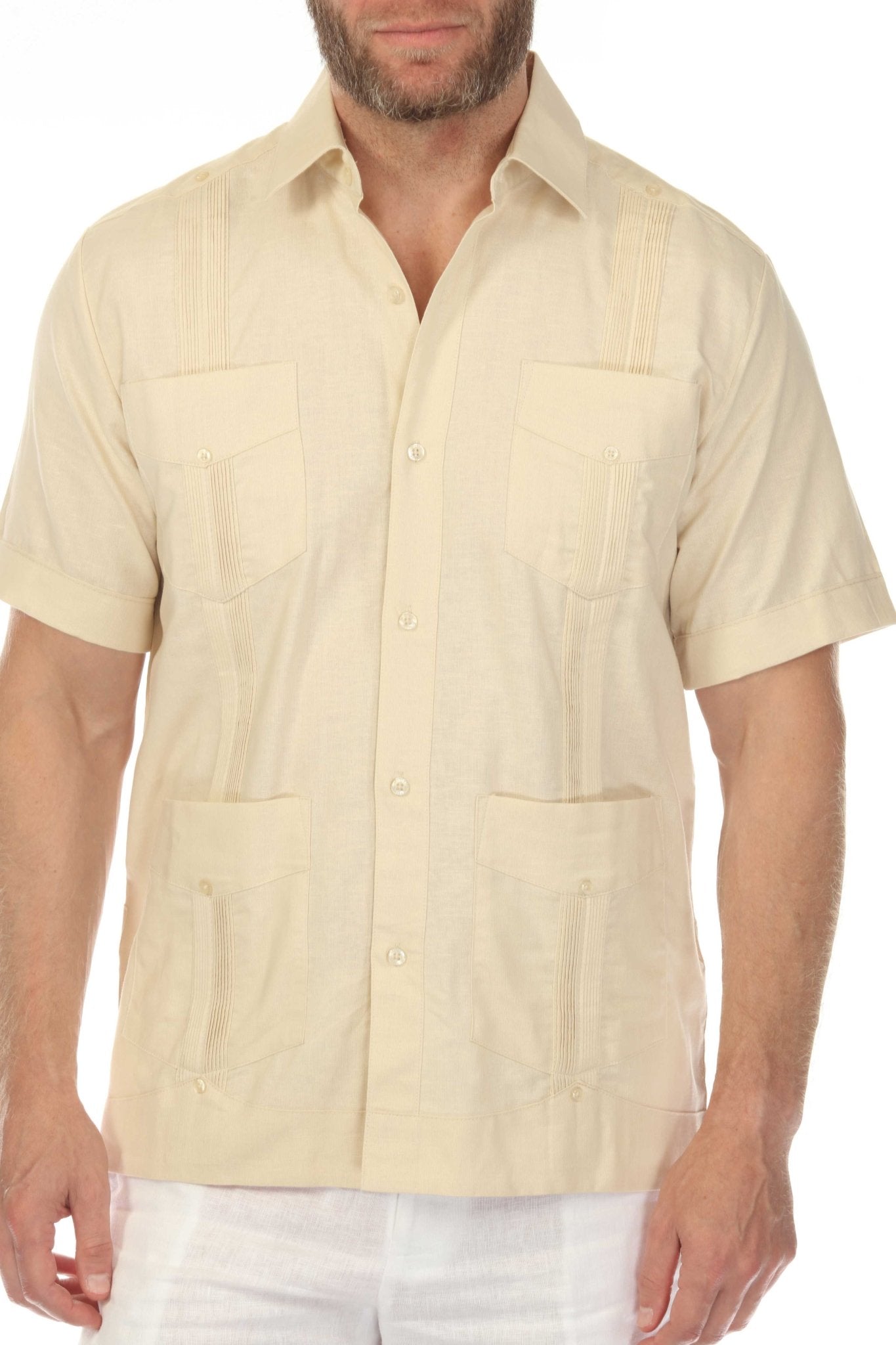 Close-up of a cream 100% linen guayabera shirt showing the refined collar, subtle embroidery, and authentic four-pocket details.