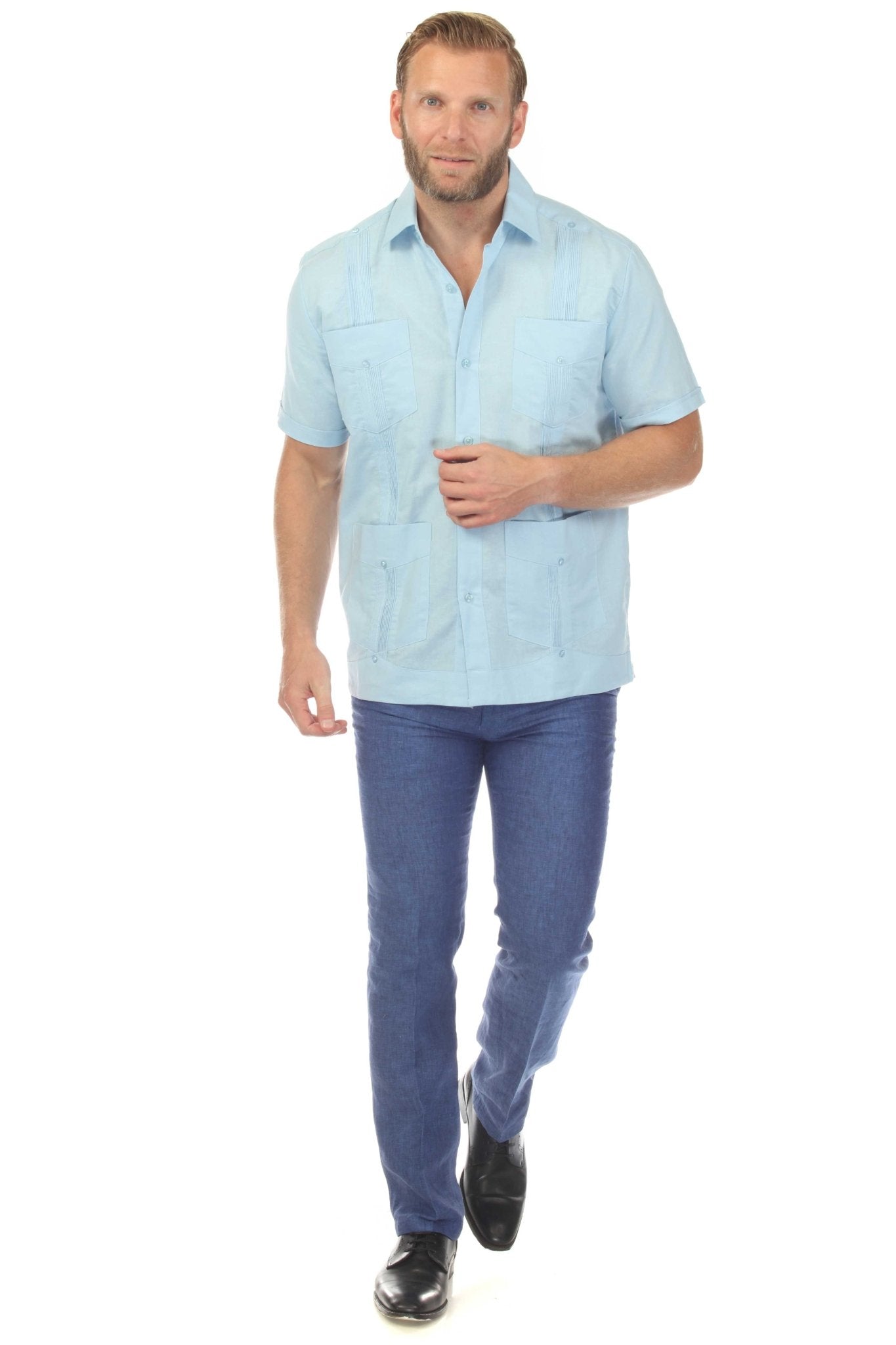 A man wearing the light blue Men’s Big & Tall 100% Linen Classic Short Sleeve Guayabera Shirt.