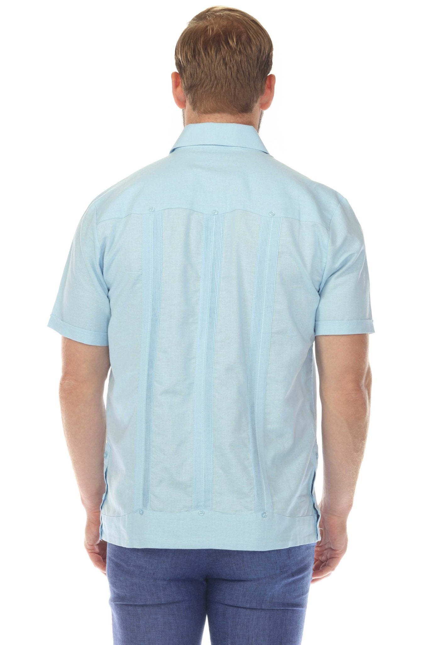 Back view of a light blue guayabera shirt made from soft, breathable linen with authentic vertical pleating for a classic silhouette.