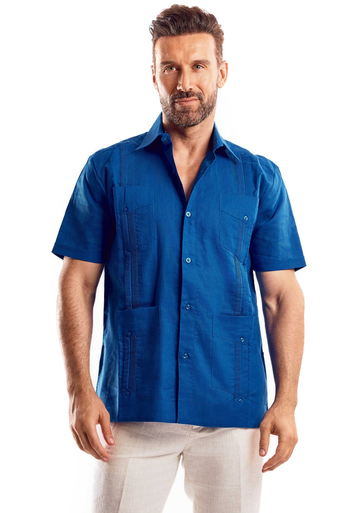 Front view of a men's white short sleeve linen guayabera shirt with subtle embroidery and functional pockets.