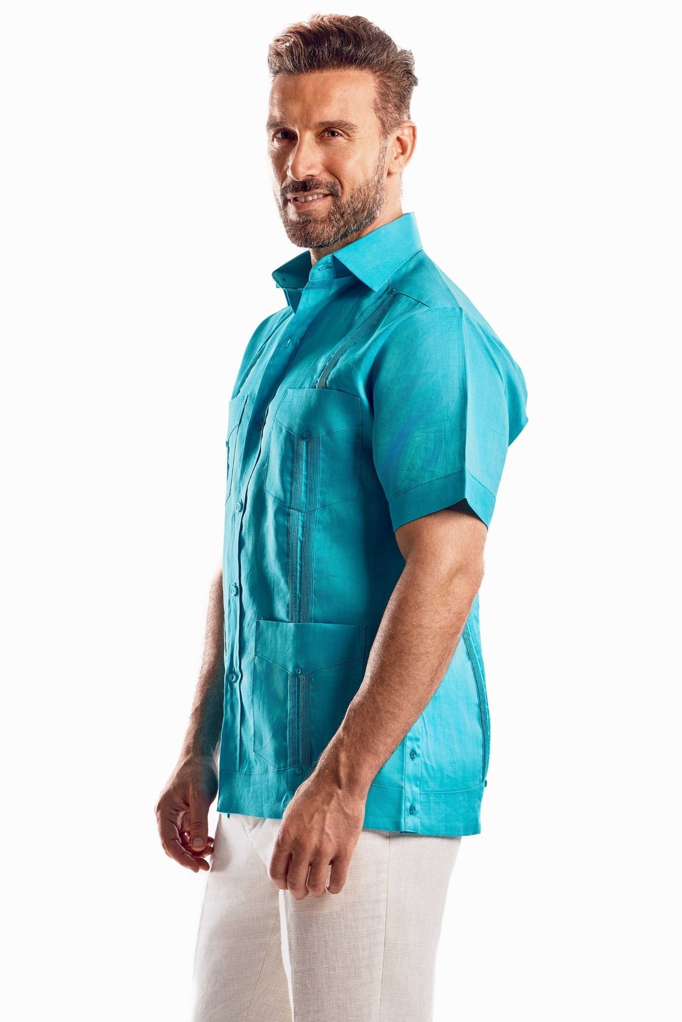 Side profile of a men's linen resort wear guayabera shirt showing the tailored-relaxed fit and short sleeve design.