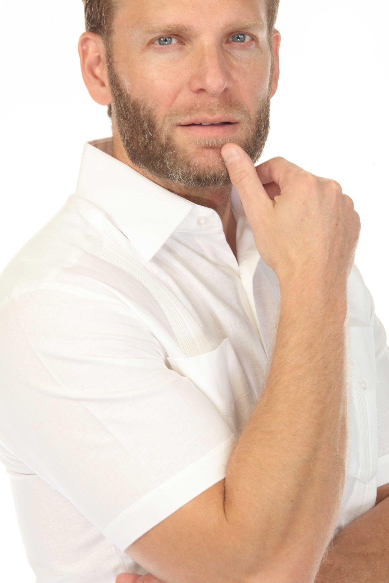 A man in a white Men's Big & Tall 100% Linen Classic Short Sleeve Guayabera Shirt.