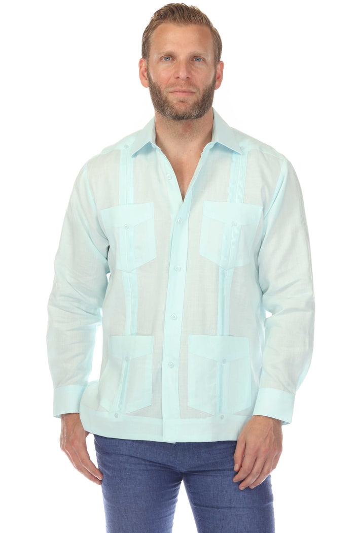 Front view of a man wearing a white Men's Linen Classic Four-Pocket Long Sleeve Guayabera Shirt.