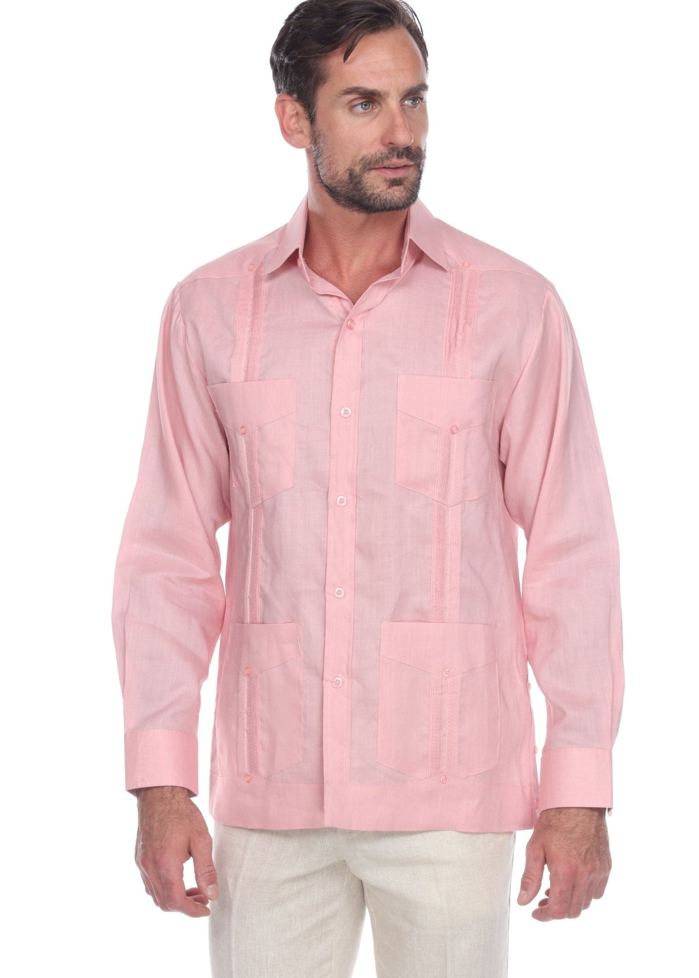 Front view of a man wearing a pink linen Men's Classic Four-Pocket Long Sleeve Guayabera Shirt.
