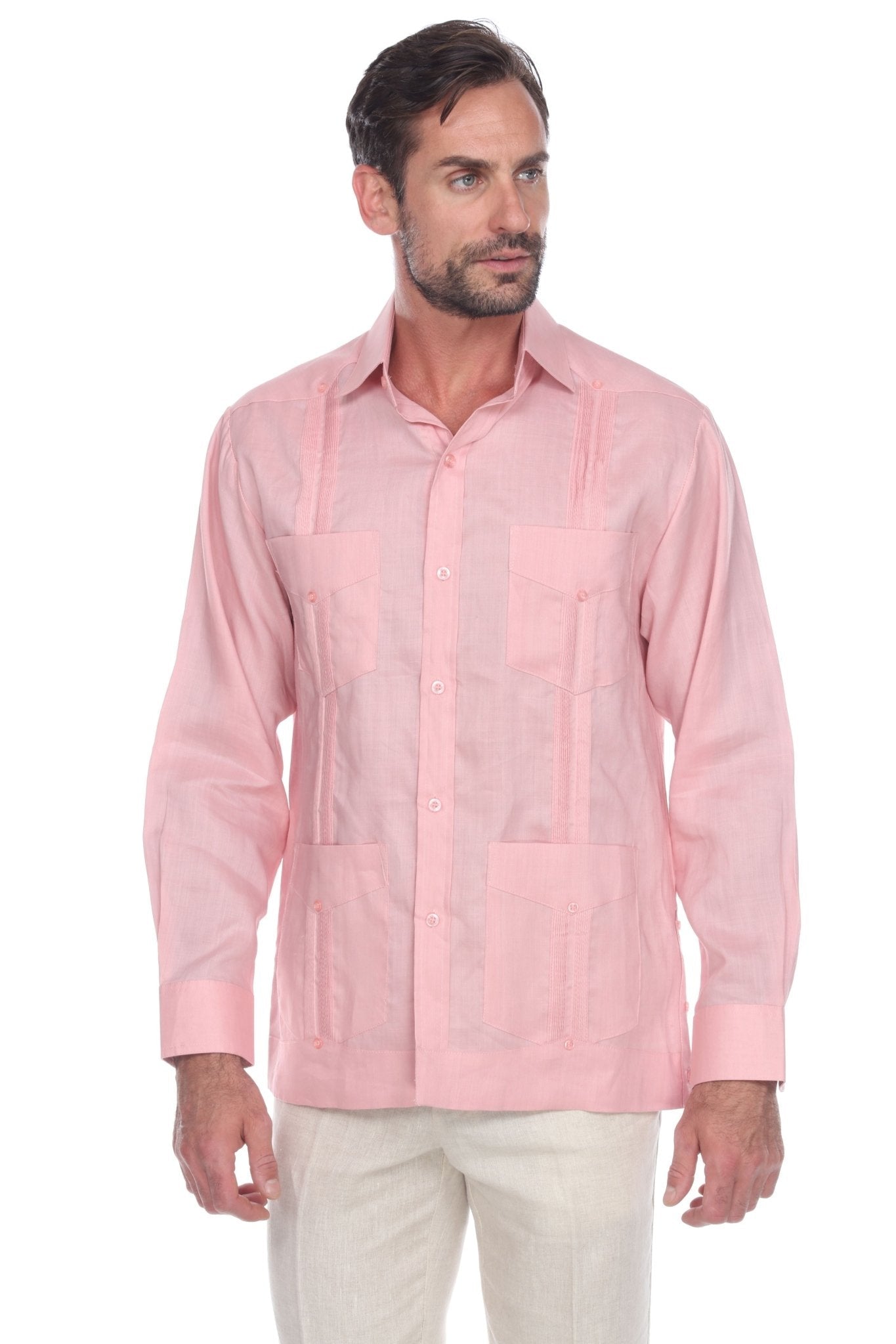 Front view of a man wearing a pink linen Men's Classic Four-Pocket Long Sleeve Guayabera Shirt.