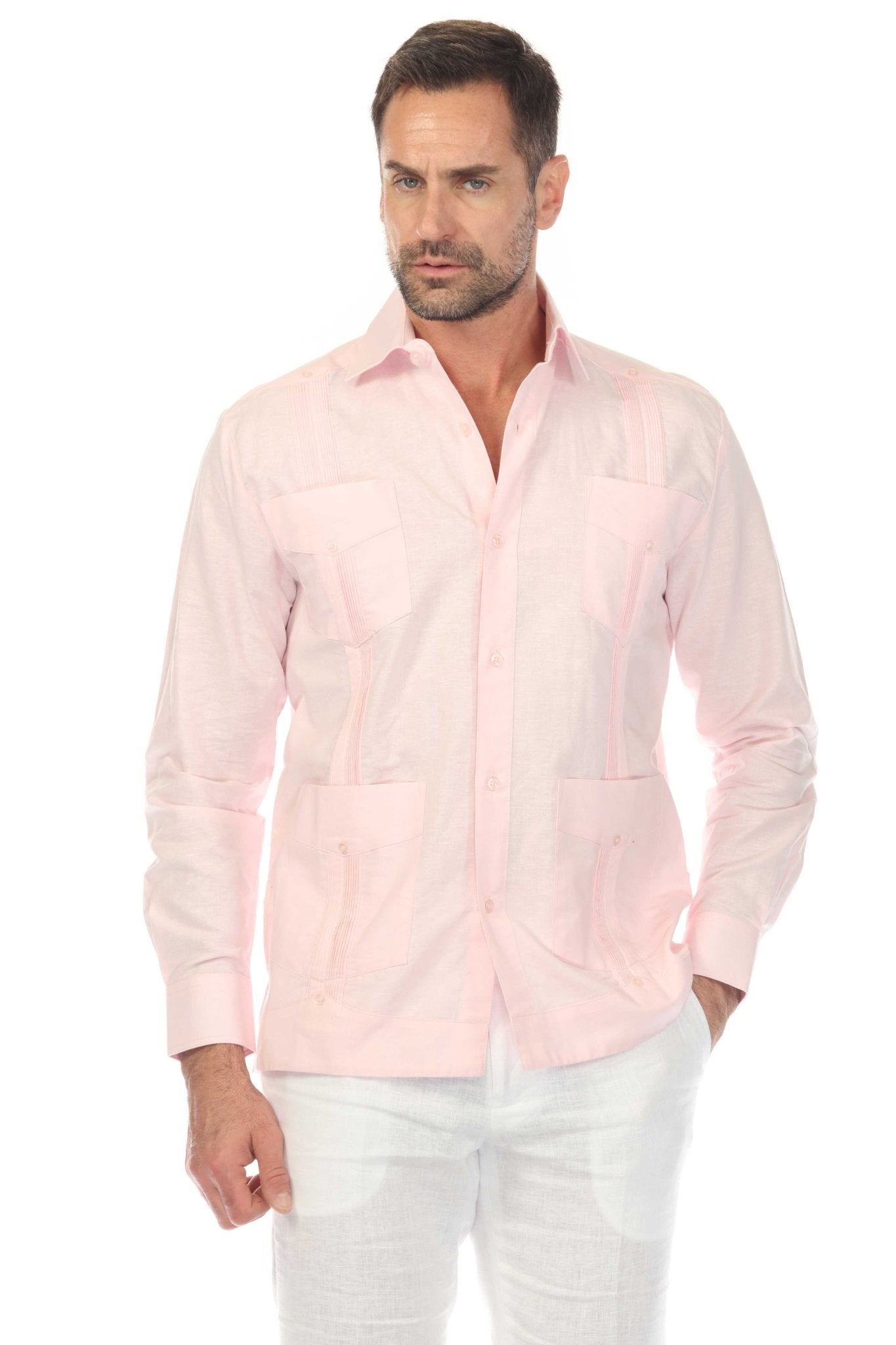 Front view of a man wearing a pink Men's Linen Classic Four-Pocket Long Sleeve Guayabera Shirt with white pants.
