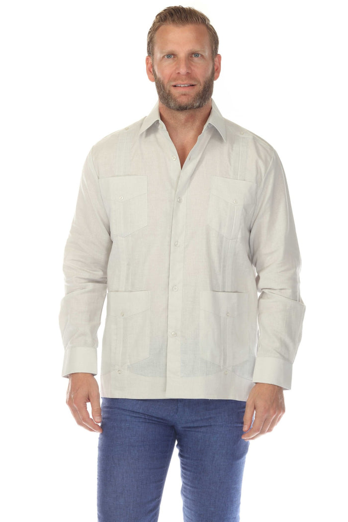Front view of a man wearing a white Men's Linen Classic Four-Pocket Long Sleeve Guayabera Shirt.