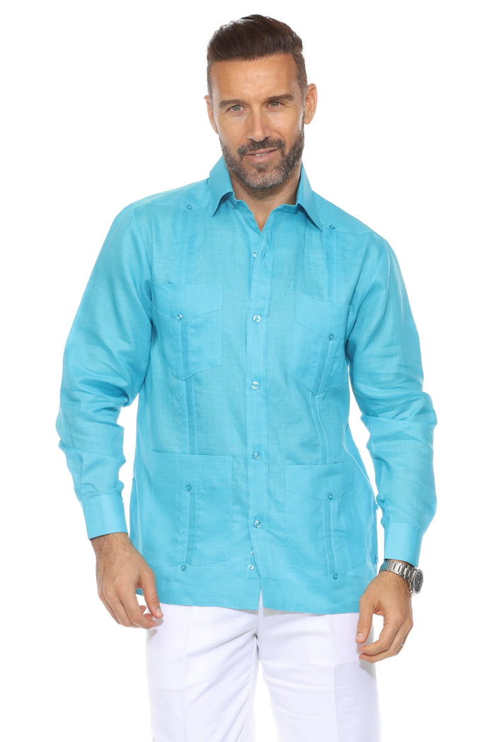Front view of a man wearing a white Men's Linen Classic Four-Pocket Long Sleeve Guayabera Shirt.