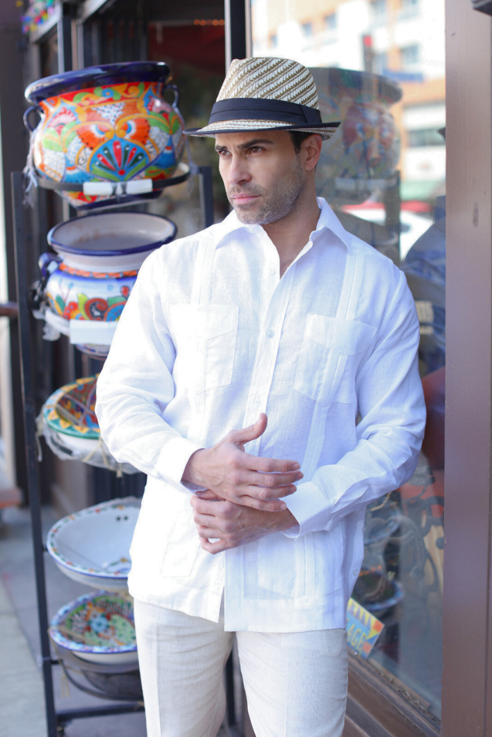 Man wearing a white, long-sleeved Men’s Big & Tall Guayabera Shirt with four pockets and a straw fedora.