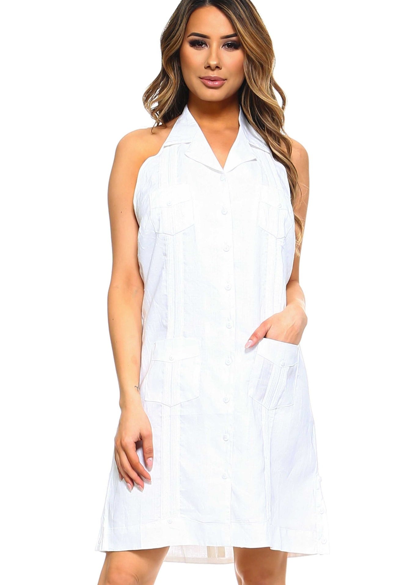 Front view of a person wearing a white Women's Guayabera Halter Button Down Dress with pockets.