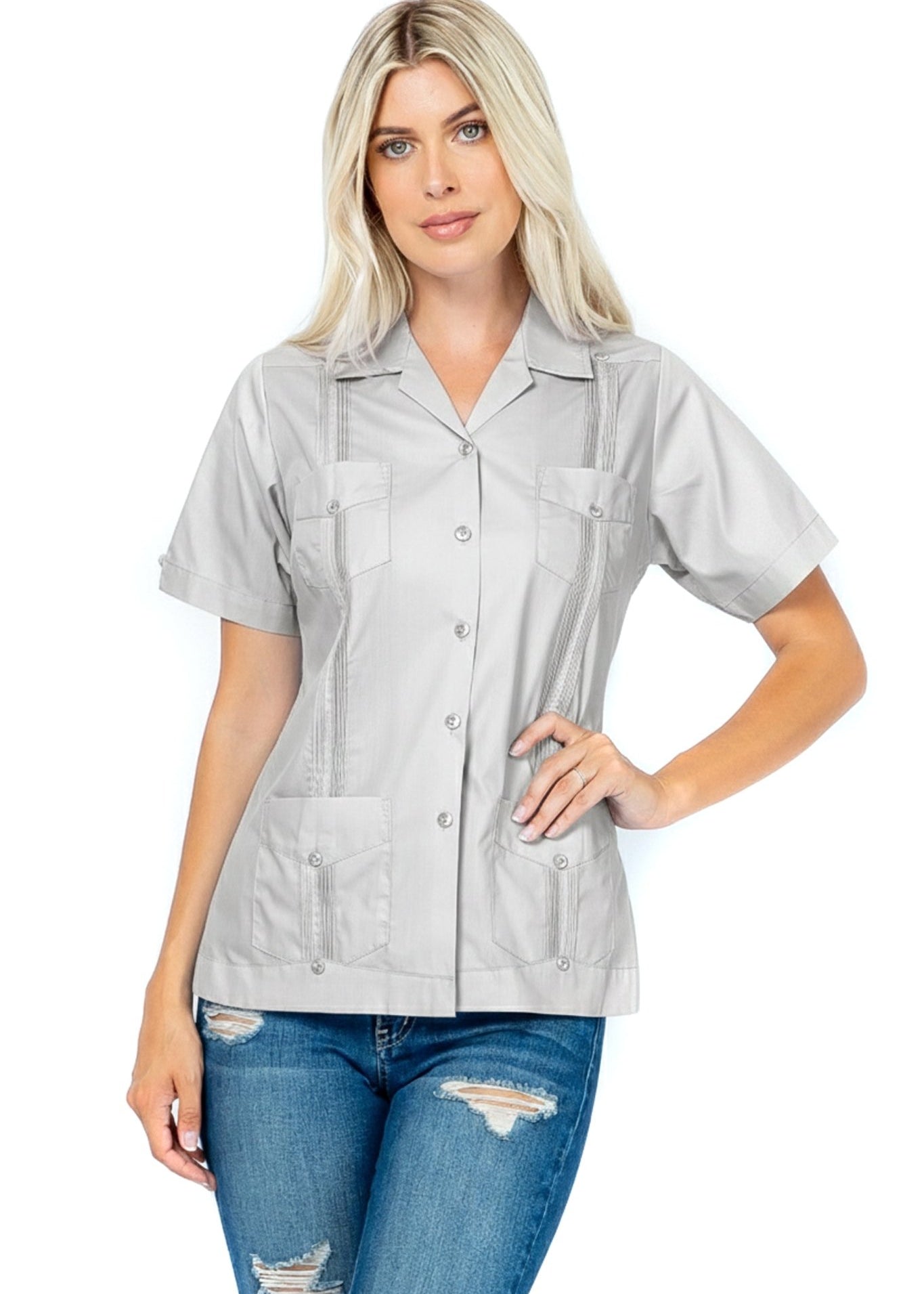 Front view of a woman wearing a gray Women's Short Sleeve Guayabera with 4 Pockets.