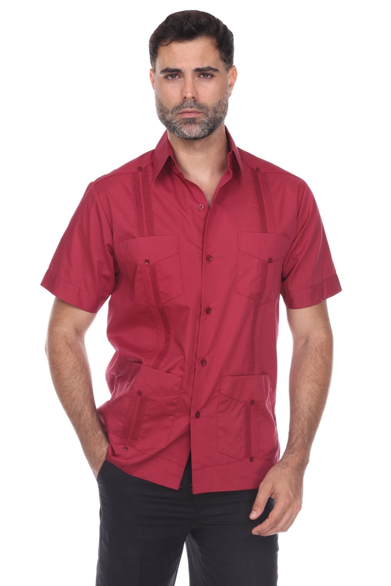 Front view of a man wearing a burgundy short sleeve guayabera shirt featuring traditional four-pocket styling, vertical pleats, and embroidered accents.
