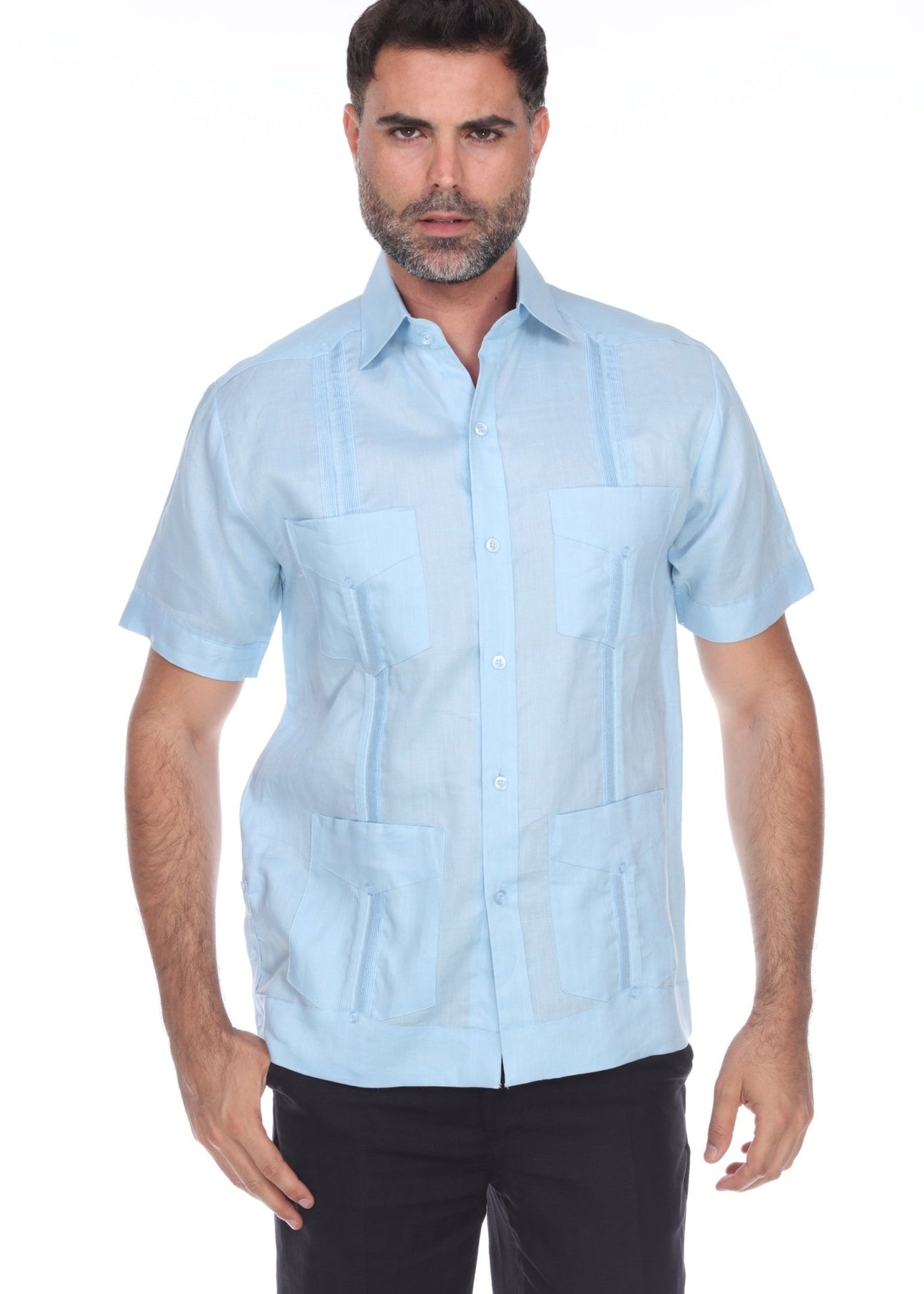 Men’s light blue short sleeve guayabera shirt featuring a traditional 4-pocket layout and breathable cotton-blend fabric.