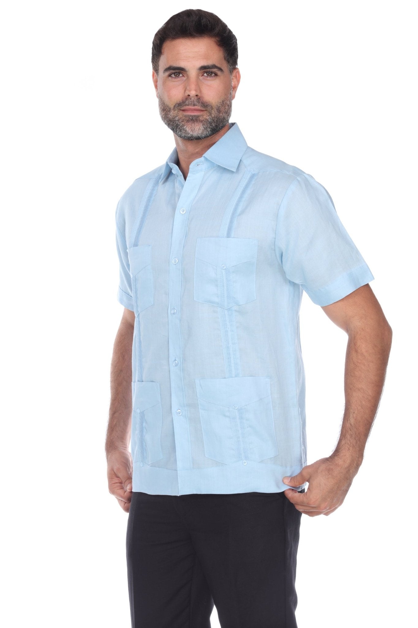 Men’s light blue short sleeve guayabera shirt featuring a traditional 4-pocket layout and breathable cotton-blend fabric.