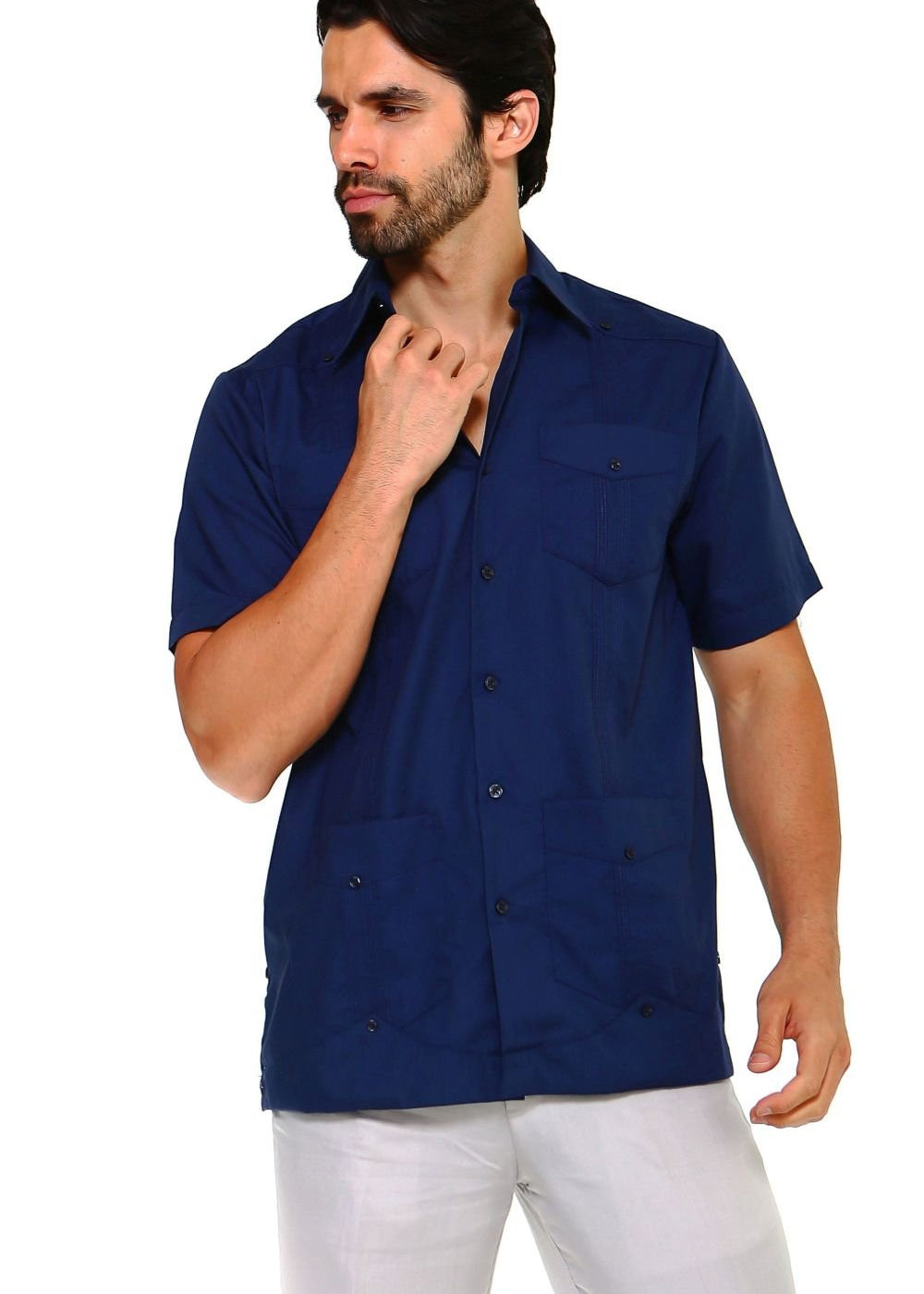 Man wearing a dark navy blue guayabera shirt featuring embroidered heritage accents and a breathable cotton-blend fabric.