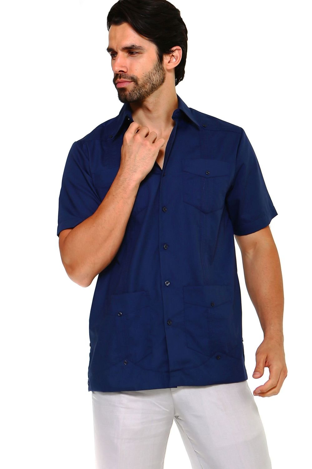 Man wearing a dark navy blue guayabera shirt featuring embroidered heritage accents and a breathable cotton-blend fabric.