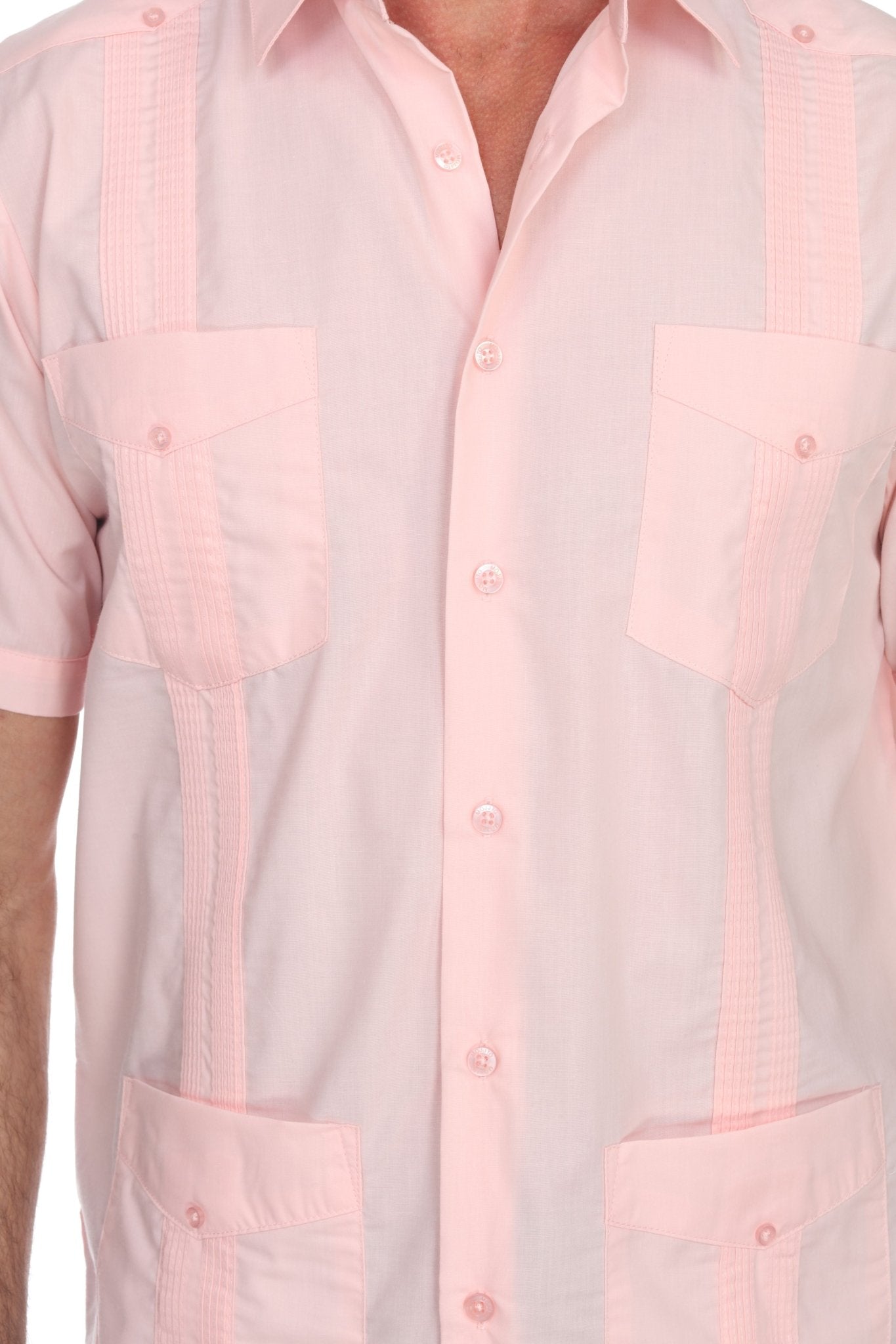 Close-up of a light pink shirt with a checkered pattern on a white background