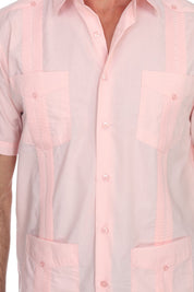 Close-up of a light pink shirt with a checkered pattern on a white background