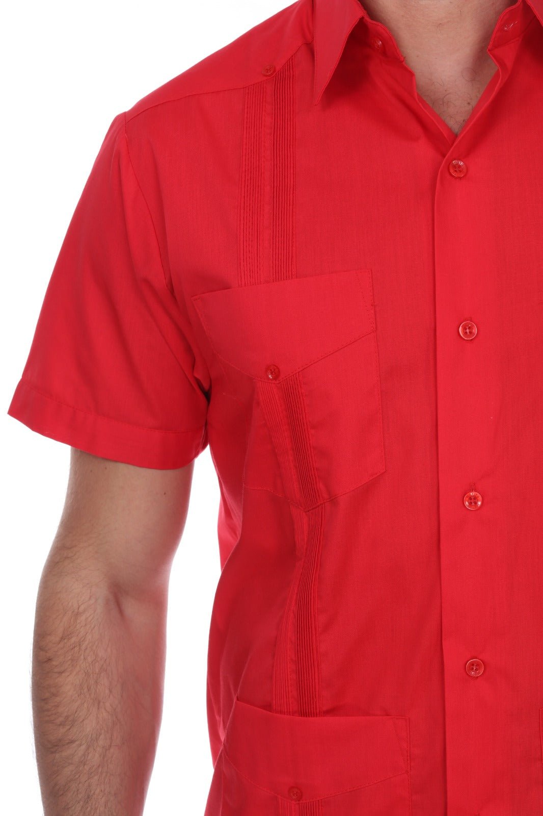 A close-up of a man wearing a bright red short-sleeve button-up shirt with a chest pocket and vertical pleat detailing on the shoulder, shown against a plain white background.
