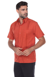 Men's short sleeve guayabera shirt in burnt orange with heritage embroidery and a structured 4-pocket design.