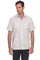A man wearing a light beige short-sleeve Guayabera-style button-up shirt with four front pockets, paired with black pants, photographed against a plain white background.