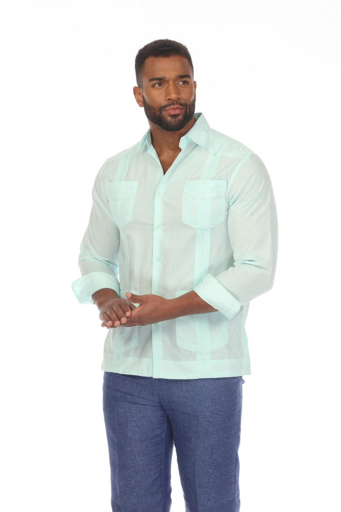 A man models the black Men’s Plus Size Guayabera Shirt, shown from the front with its four visible pockets.